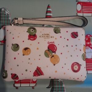 Coach White Wristlet with Colorful Christmas Ornament Print